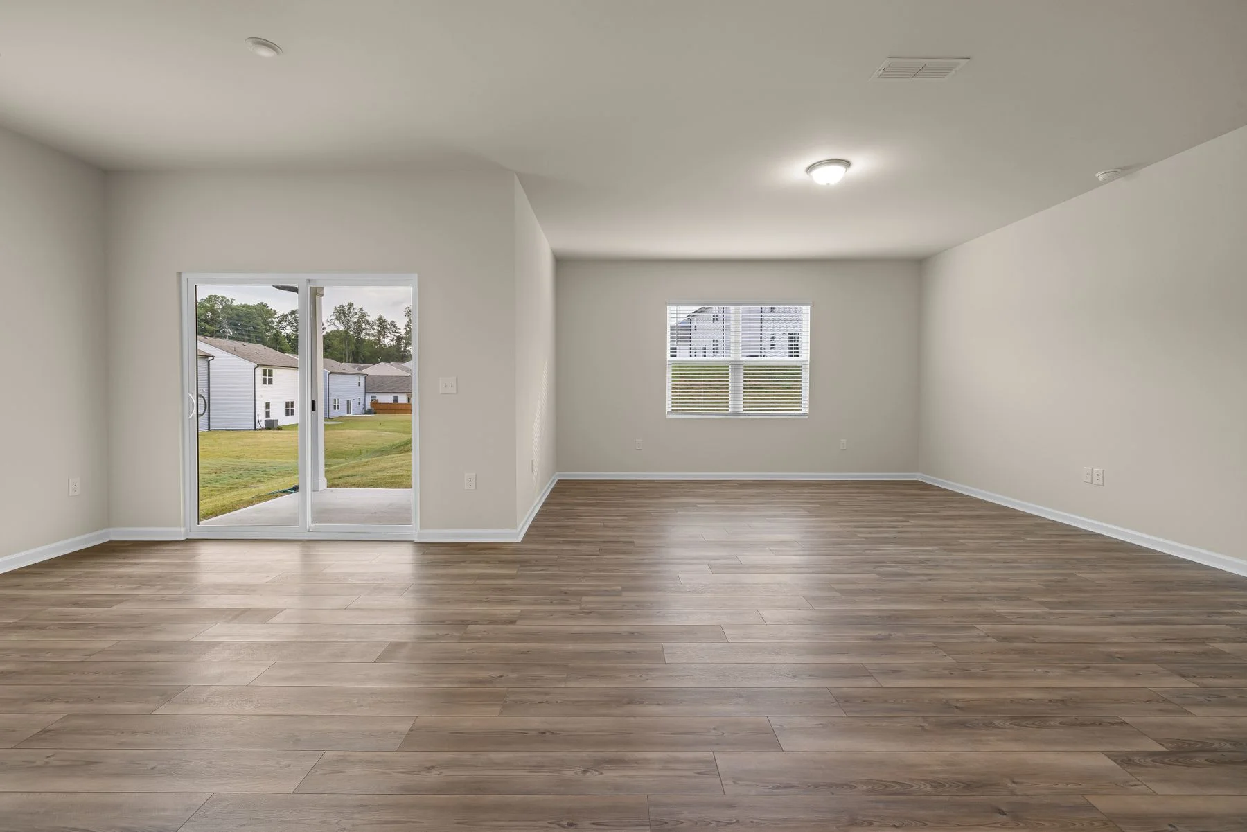 Wood-look flooring through a bright open living room